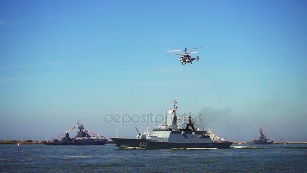 Military naval ship and flying helicopter during a parade — Stock Video