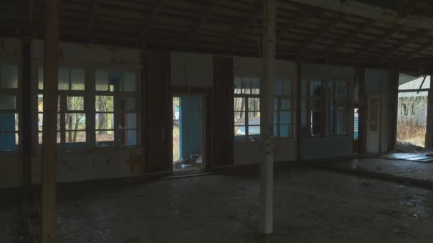 Interior of an abandoned building broken windows — Stock Video