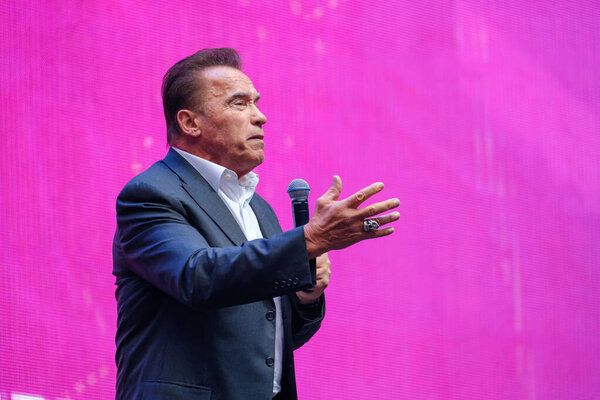 Arnold Schwarzenegger, famous actor, politician and businessman, speaks at a business forum