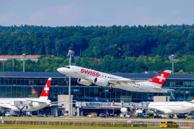 Swiss airlines airplanes preparing for take-off at day time in international airport
