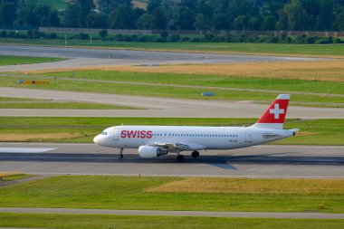 Swiss airlines airplanes preparing for take-off at day time in international airport