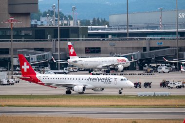 Swiss airlines airplanes preparing for take-off at day time in international airport