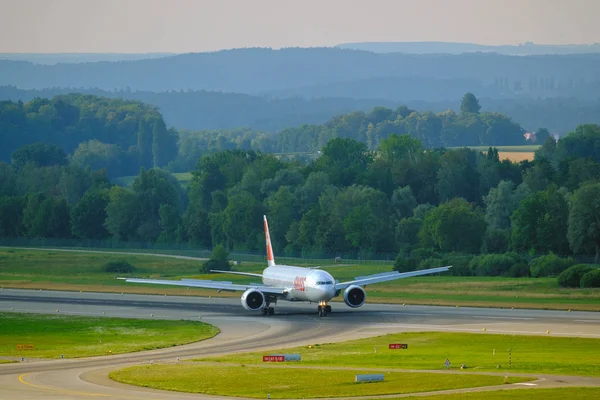 Swiss airlines airplanes preparing for take-off at day time in international airport — ストック写真