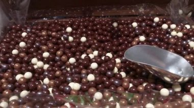 Chewing marmalade in a candy store