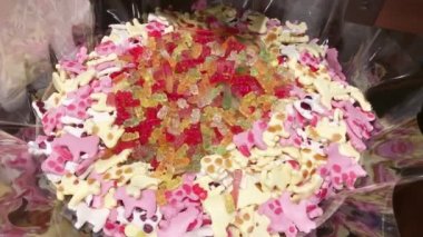 Chewing marmalade in a candy store