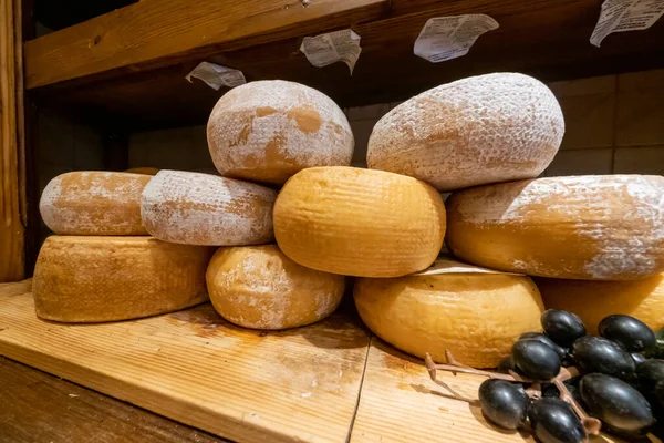 Large selection of cheese in local food shop — Stock Photo, Image