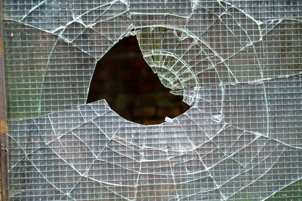 Broken glass in the window of warehouse