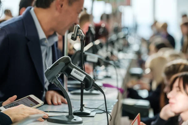 Business forum visitors register at the front desk