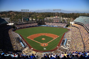 Dodger Stadium - Los Angeles Dodgers. LOS ANGELES - JUNE 30: Classic view of Dodger Stadium before a sunny day baseball game on June 30, 2012 in Los Angeles, California. Dodger Stadium opened in 1962 and cost $23 million. clipart