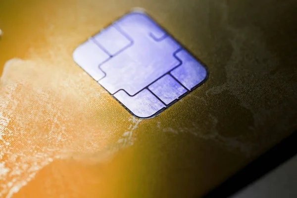 Electronic contactless credit card with selective focus microchip. Macro of a credit card.