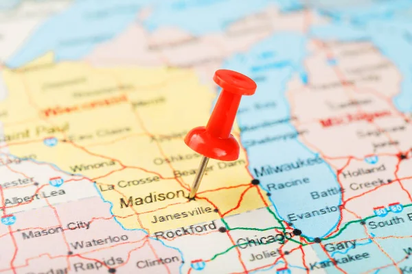 Red clerical needle on a map of USA, Michigan and the capital Lansing. Close up map of Michigan with red tack, United States map pin USA