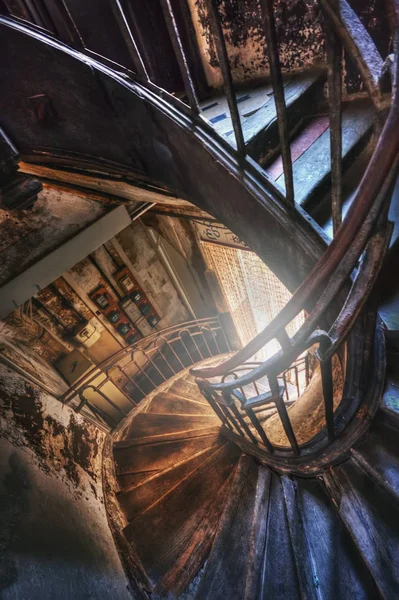 Spiral staircase in the old house Stock Picture