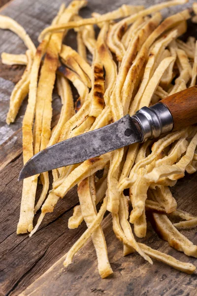 Stripes of sliced pancake on wood — Stock Image Stripes Sliced Pancake Wood Stock Image