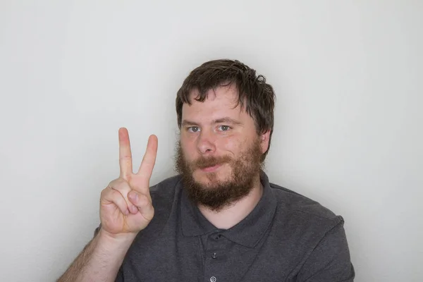 Man Holding His Fingers Greeting You Peace Gesture — Stock Photo, Image