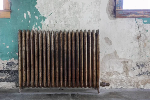 Old fasion heating unit in a worn out building