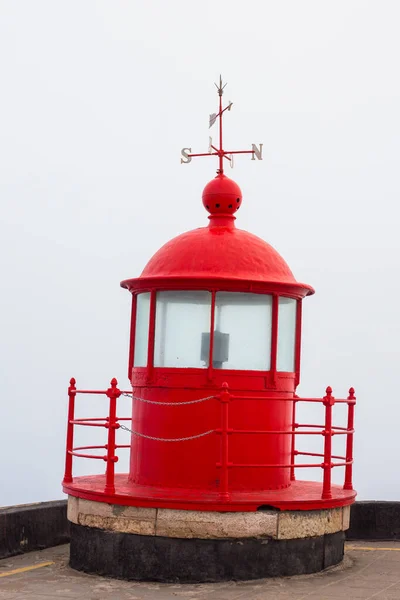 Red lighthouse lamp room in Nazare, Portugal. — ストック写真