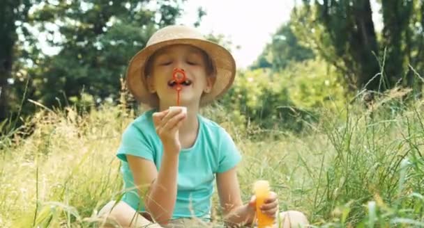 Girl blowing soap bubbles — Stock Video