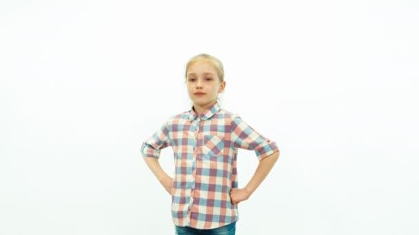 Girl smiling on the white background and builds horns — Αρχείο Βίντεο