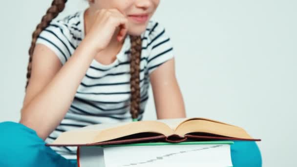 Close up portrait cheerful girl reading book and smiling at camera with teeth on white — Stock Video