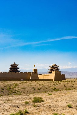 jiayuguan in Gansu province of China/ancient gate at the west point of Great Wall  clipart