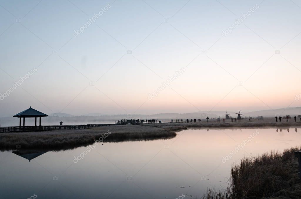 misty lake in the morning/ photo taken on the grassland in deep autumn 