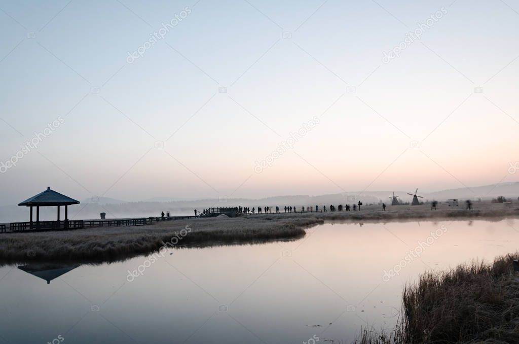 misty lake in the morning/ photo taken on the grassland in deep autumn 
