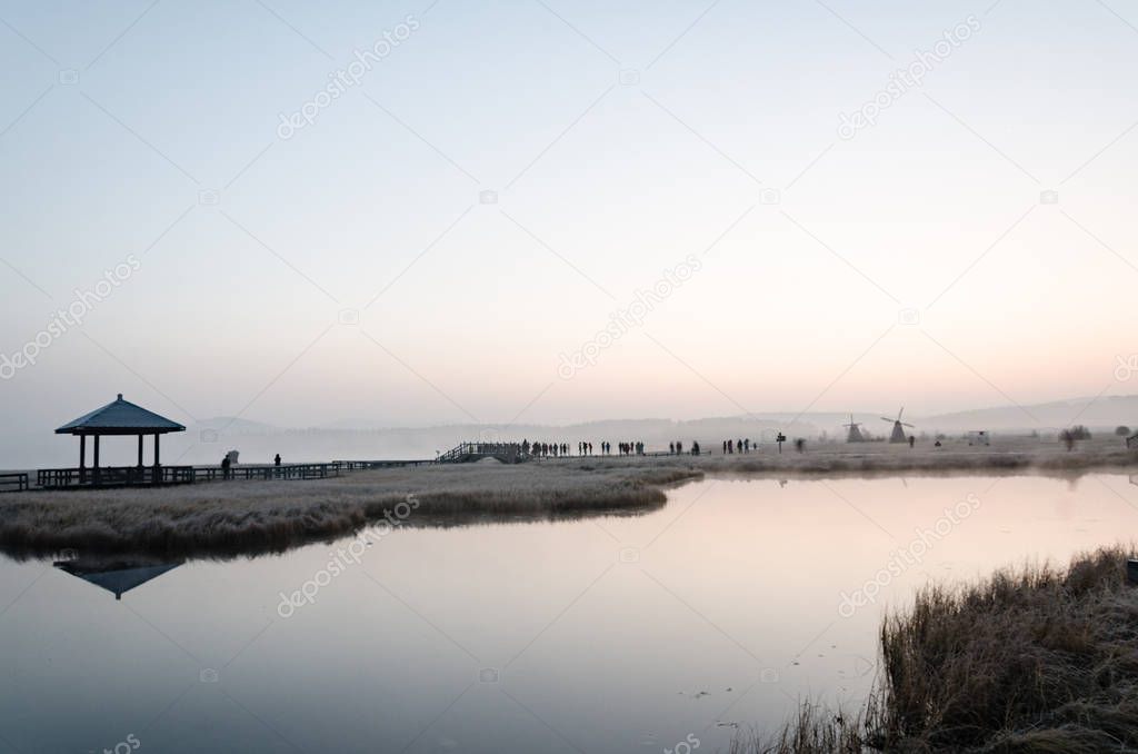 misty lake in the morning/ photo taken on the grassland in deep autumn 