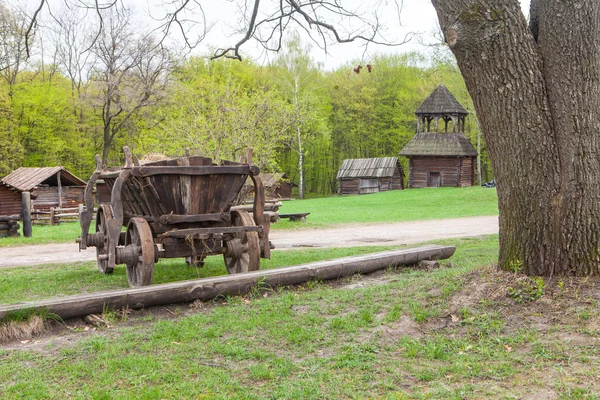 Old wooden wagon parked in rural landscape — Stock Photo, Image