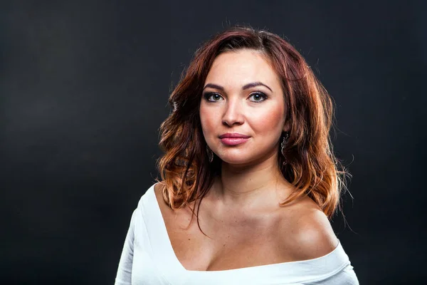 Pretty young girl on black background in studio — Stock Photo, Image