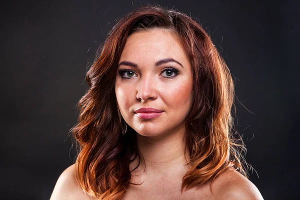 Pretty young girl on black background in studio — Stock Photo, Image