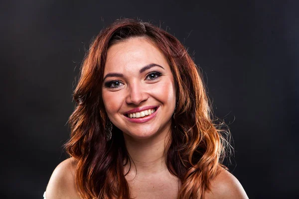 Pretty young girl on black background in studio — Stock Photo, Image