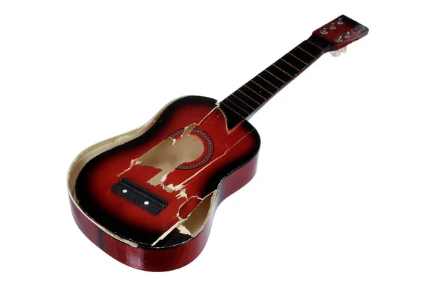 Una guitarra rota Imágenes de stock libres de derechos