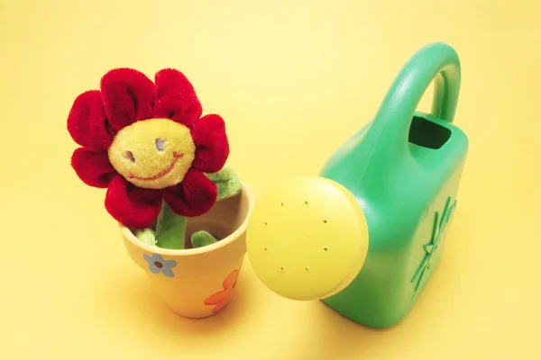 Toy Sunflower and Watering Can — Stock Photo, Image