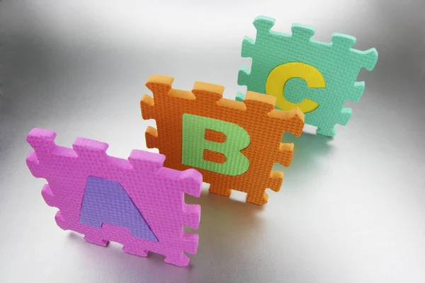 Espuma alfabeto Puzzle Peças — Fotografia de Stock