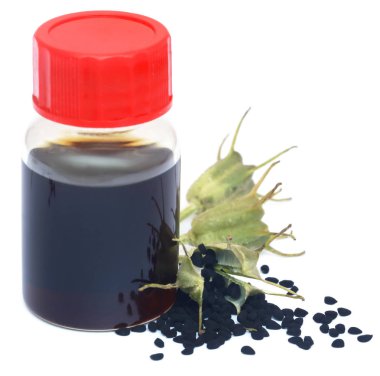 Nigella tohumları ve cam bir şişede gerekli yağ