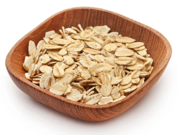 Oats in wooden bowl — Stock Photo, Image