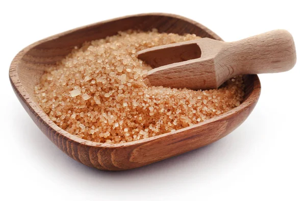 Brown sugar with wooden scoop — Stock Photo, Image