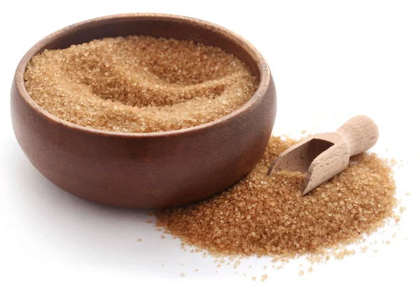 Brown sugar with wooden scoop — Stock Photo, Image