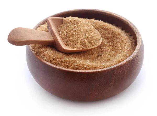 Brown sugar with wooden scoop — Stock Photo, Image