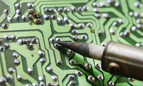 Television motherboard with soldering iron