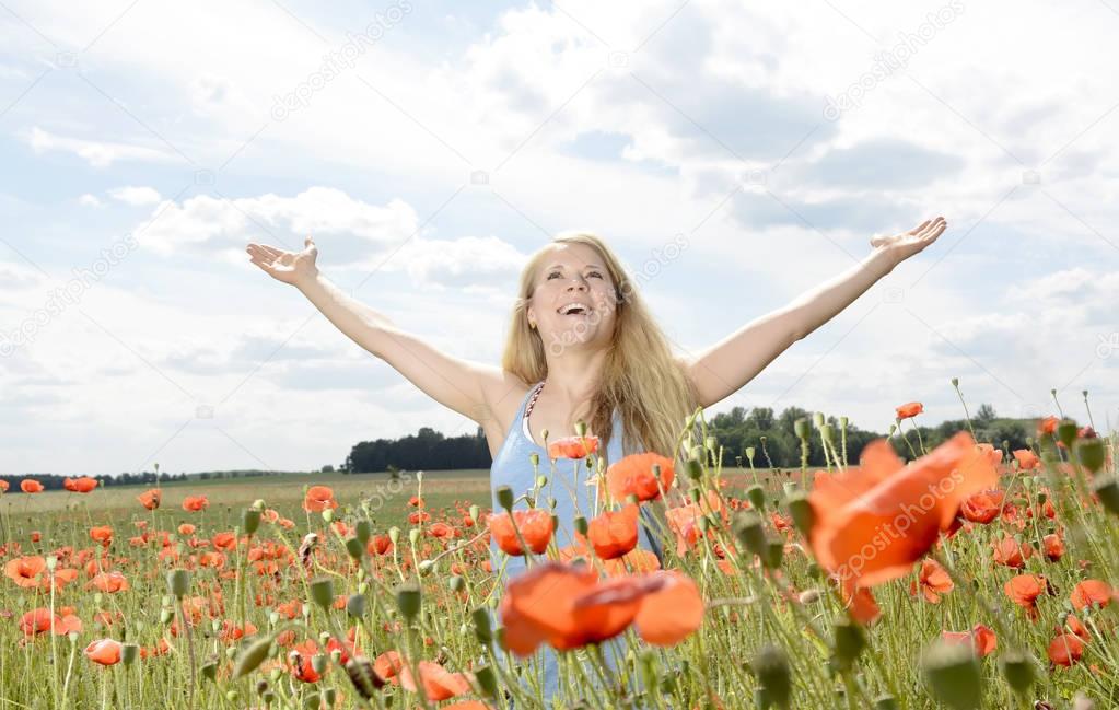 woman in poppy field