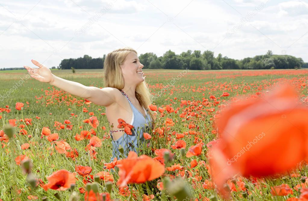 woman in poppy field