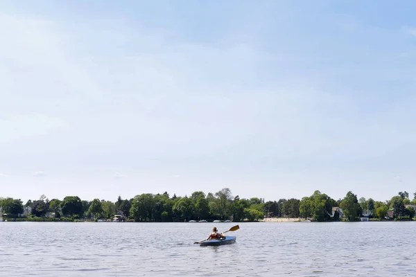Woman in paddle boat — Stock Photo, Image