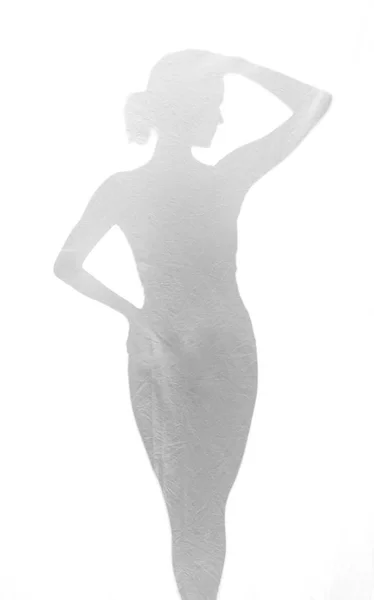Mulher atrás de papel alumínio — Fotografia de Stock