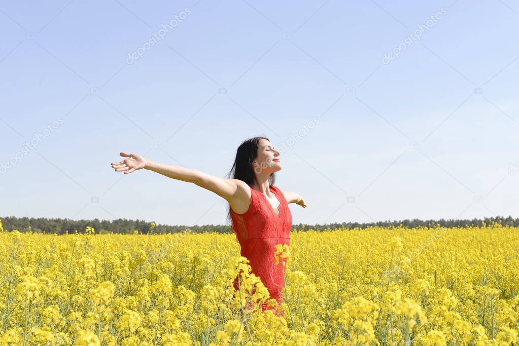  Young woman cheering in the rape field