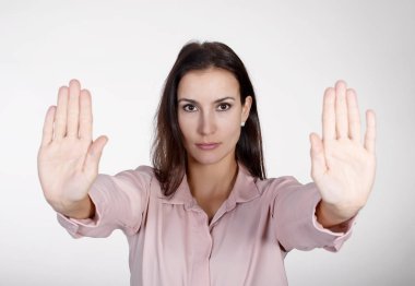 beautiful young woman showing stop with two hands clipart