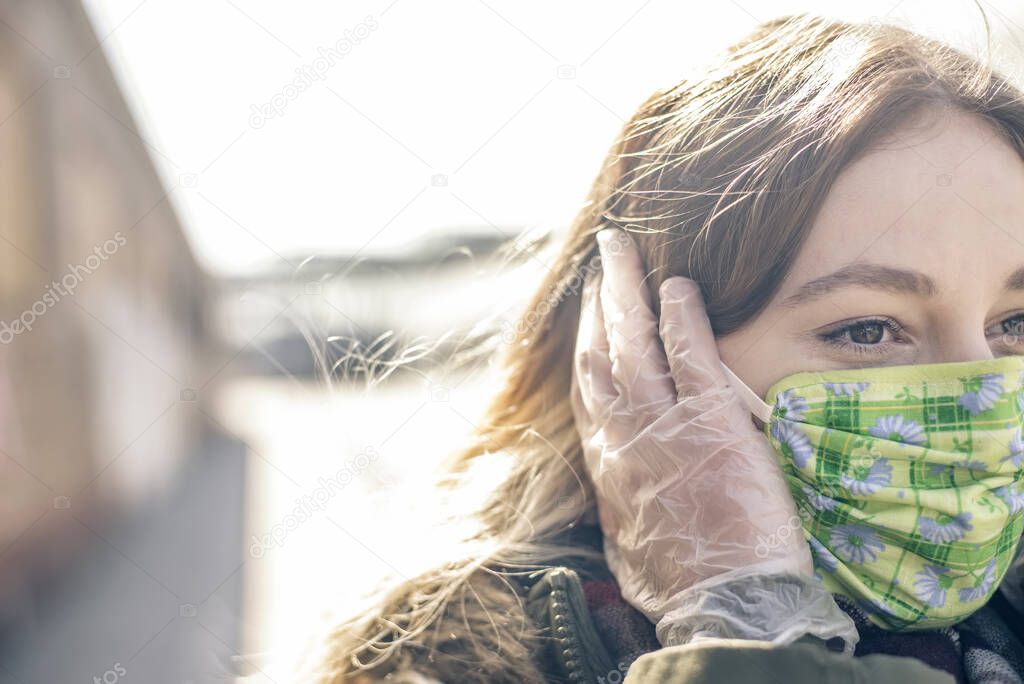 young woman with mask in the city