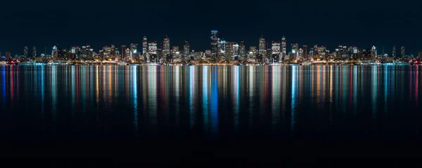 Fantastic nighttime panoramic city view with illuminated skyscr