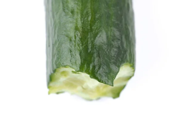 Bitten green cucumber on a white background — Stock Photo, Image