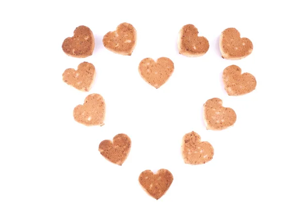 Galletas en forma de corazones sobre un fondo blanco — Foto de Stock